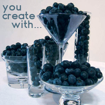 Glass vessels and blueberries, an edible blue theme.