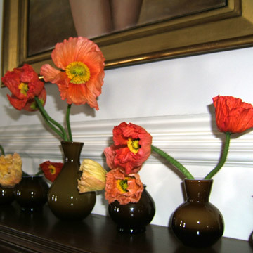 Italian orange Poppies in brown bud vases...simple and stunning. 